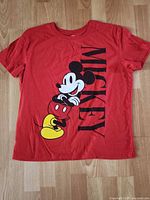 Full front view of red Mickey Mouse T-shirt