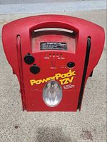 Front view showing Power Pack 12V branding, flashlight lens, controls