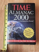 Front cover with tape measure showing height ~9–10 in