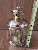 Full view showing lantern height next to tape measure