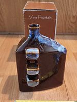 Front view of ceramic fountain and box