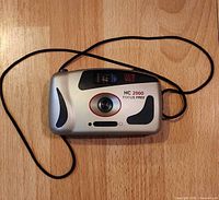 Front view of DS MAX HC 2000 camera with wrist strap