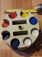 Top view of carousel showing measurement tape, chip colours and slot arrangement