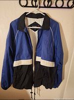 Front view showing color blocking, zipper, drawcords