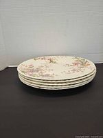 Stack of five matching plates