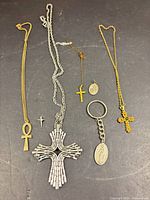All six jewelry items laid out on surface