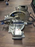 Full view of Delta ShopMaster 10-inch compound miter saw showing base, blade, guard and power cord
