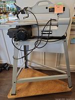 Full view of Delta SS350 scroll saw on stand and wheeled plywood base