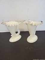 Pair of Fenton Silver Crest cornucopia candleholders front view