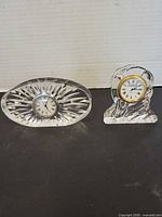 Front view of both crystal and glass clocks