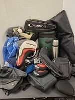 Mixed golf accessories piled together