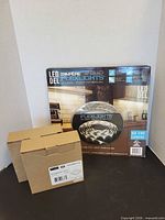 Retail box of LED Flexlights kit alongside two smaller boxed fixtures