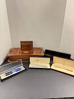 Group view: jewelry valet, pen cases, bolo ties