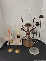 Group shot showing all five candle holders
