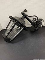 Lantern lying on side showing overall shape and glass panels
