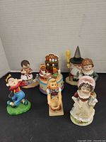 Group shot of all figurines and music box