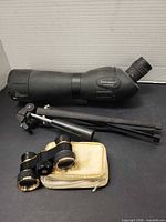 Bushmaster spotting scope, tripod, opera glasses with case grouped