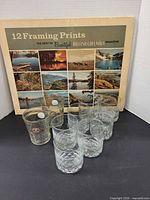 Group shot of tumblers, The Keg glasses and print portfolio
