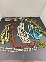 All seven necklaces laid out for full view