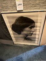 Front view of framed black and white portrait print showing entire item