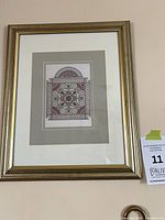 Framed giclée print on wall showing full frame, mat and artwork