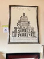 Full view of framed architectural print hanging on wall