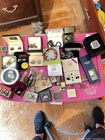 Overview of entire mixed jewelry lot on table