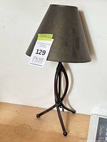 Full view of table lamp showing base design and shade