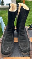 Front view of both boots showing suede uppers, shape and height