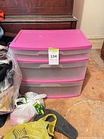 Front view of pink-topped three-drawer polypropylene storage unit