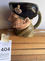 Left side profile of Royal Doulton Monty jug showing handle and cap