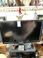 Front view of Sharp Aquos LED/LCD TV on stand