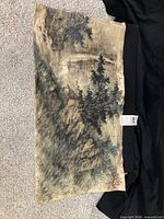 Full view of unframed ink wash painting showing overall landscape scene and condition