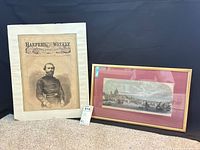 Both framed prints side by side showing portrait of Major-General Thomas and river scene lithograph
