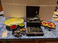 Overall lot showing bowl, mugs, Starbucks tray, shot glasses, wine opener box