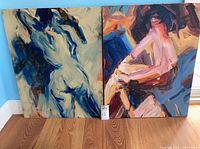 Both paintings side by side showing size, colors and subjects