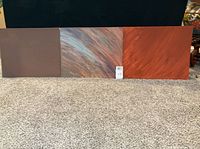 Front view of three 16"x20" abstract canvas panels in brown, multicolor streak, and red