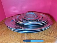 Stacked view of all stainless steel plates and platters
