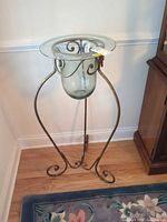 Full view of metal plant stand with glass components assembled