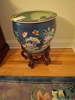 Full view of porcelain planter on stand