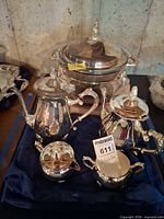 Overall view of silverplate coffee service pieces and covered serving bowl