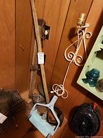 Overall view showing wooden pole, CycloVac head, wall sconce, glass insulator and metal tools