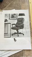 Printed product image showing style of brown faux leather office chair