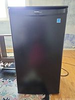 Front view of black Danby Designer compact refrigerator
