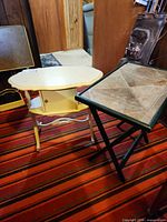 Both tables side by side on striped carpet