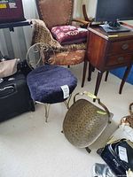 Vanity stool and brass coal scuttle on floor