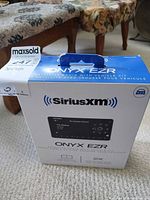Front view of sealed SiriusXM Onyx EZR retail box