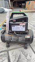 Front view of Team Mechanix model 410788 compressor showing tank, motor housing, handle and general wear