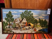 Front view of framed cross stitch showing full artwork and wooden frame