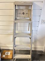 Front view of aluminum 4-step ladder